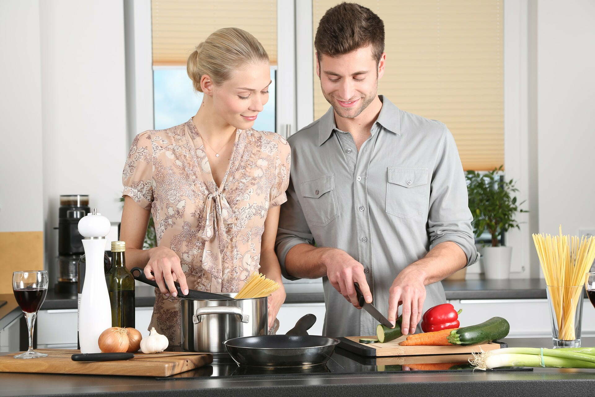 couple cooking in open concept home